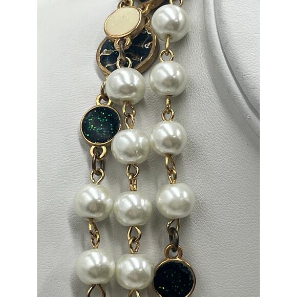 Tory Burch Authentic Long
Pearl Logo Medallion
Multi-Strand Gold 60" Necklace - Picture 10 of 15